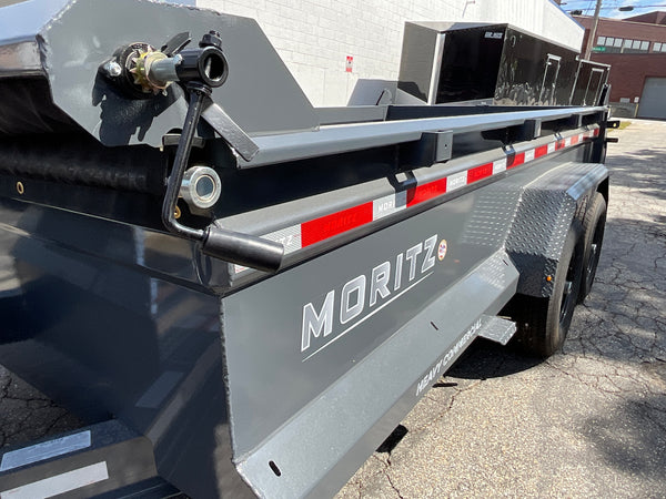 Moritz International Scissor Hoist Dump Trailer 81.5"x14' Charcoal, 14k GVWR, Cold Rolled 8" I-Beam, Torsion Axles, Aluminum Ramps, 24" Sides, Stake Pockets, Solar Charger, Hydraulic Jack, Tarp Kit, Forged 4-Bolt Coupler, 2 Year Warranty