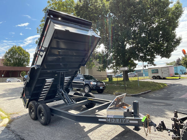 Moritz International Scissor Hoist Dump Trailer 81.5"x14' Charcoal, 14k GVWR, Cold Rolled 8" I-Beam, Torsion Axles, Aluminum Ramps, 24" Sides, Stake Pockets, Solar Charger, Hydraulic Jack, Tarp Kit, Forged 4-Bolt Coupler, 2 Year Warranty