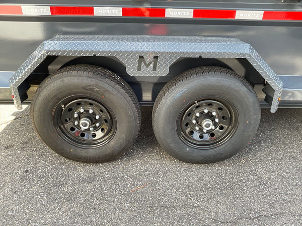 Moritz International Scissor Hoist Dump Trailer 81.5"x14' Charcoal, 14k GVWR, Cold Rolled 8" I-Beam, Torsion Axles, Aluminum Ramps, 24" Sides, Stake Pockets, Solar Charger, Hydraulic Jack, Tarp Kit, Forged 4-Bolt Coupler, 2 Year Warranty